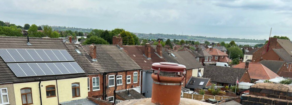 This is a photo taken from a roof which is being repaired by TRP Roofing Stamford Bridge, it shows a street of houses, and their roofs