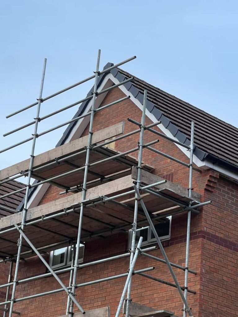 This is a photo of a roof which has just been repaired. There is a scaffold located at the gable end for access onto the roof. Works carried out by TRP Roofing Stamford Bridge